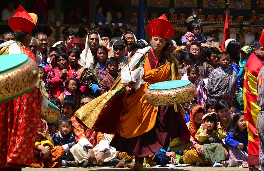 A monk playing drum at Thangbi Mani Tshechu.